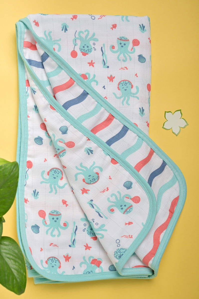 Organic muslin baby blanket with octopus design