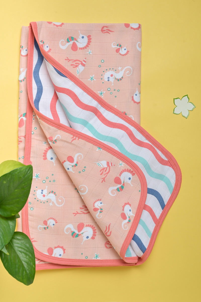 Organic muslin baby blanket with seahorse design