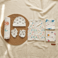 Seven-piece newborn gift set with printed vest, elephant accessories and animal-print cloths