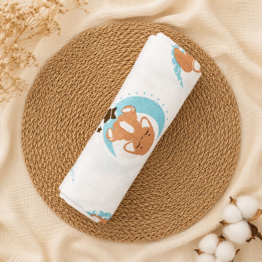 Rolled white baby swaddle with woodland-animal illustrations